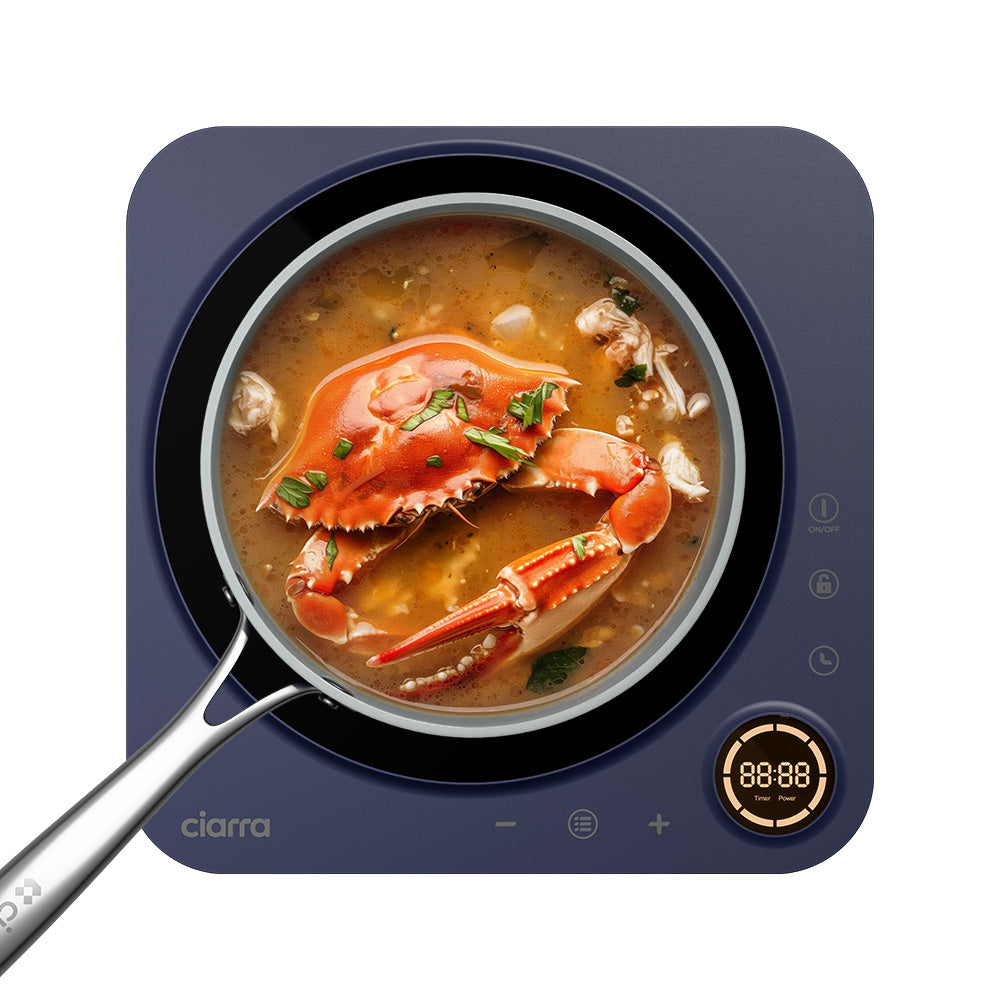 Top-down Ciarra Donut CATIH1A-M Midnight Dream cooktop depiction in blue-indigo with one pan, one cooking ring and touch controls