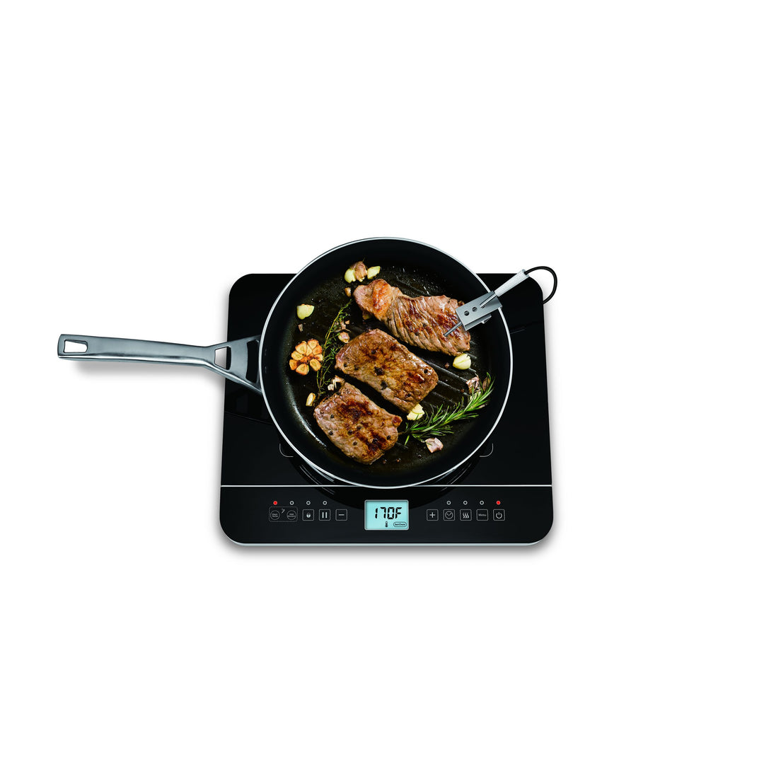 Black Salton ID1880 single-zone induction cooktop shown with a pan and wired food probe; front touch controls are visible.