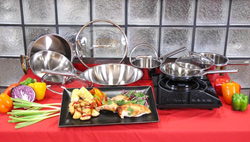A black single-zone induction cooktop alongside a group of stainless cookware pieces in the True Induction SBSET package image